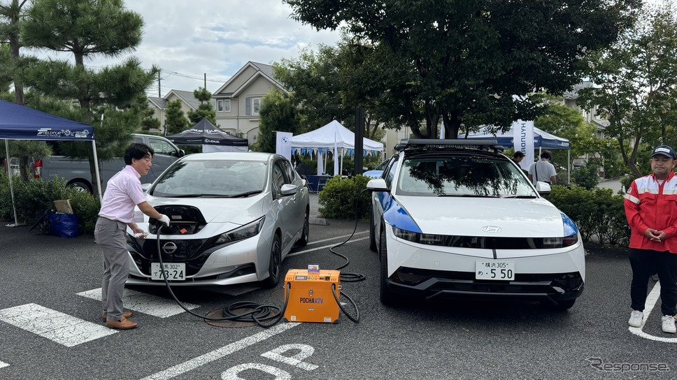 電欠駆けつけサービスのデモは、オリジン社可搬型EV充放電器「POCHA V2V」を用いて行われた《photo by Kazuya Miura》